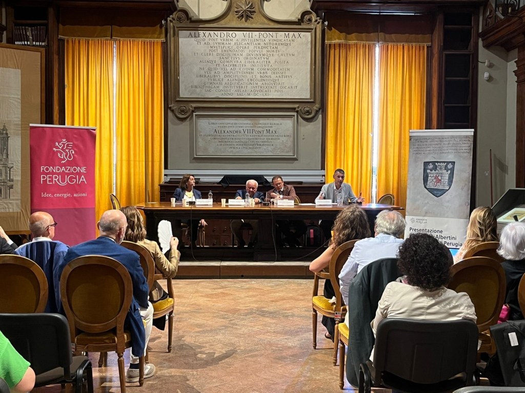 A conference at the Archivio di Stato di Roma presenting the Albertini Collection, with attendees and officials at a table.