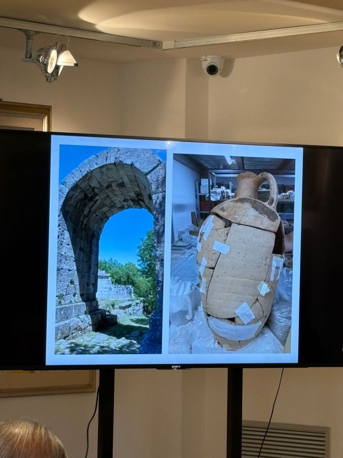 A digital display showing a historic stone archway on the left and a detailed view of an ancient amphora on the right, featuring restoration work in progress.