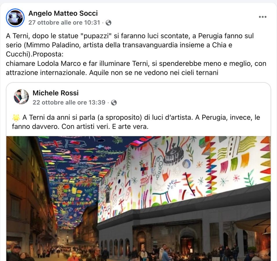 Un'installazione artistica di luci e colori su un edificio a Terni, con decorazioni vivaci e persone che camminano sotto il display luminoso.