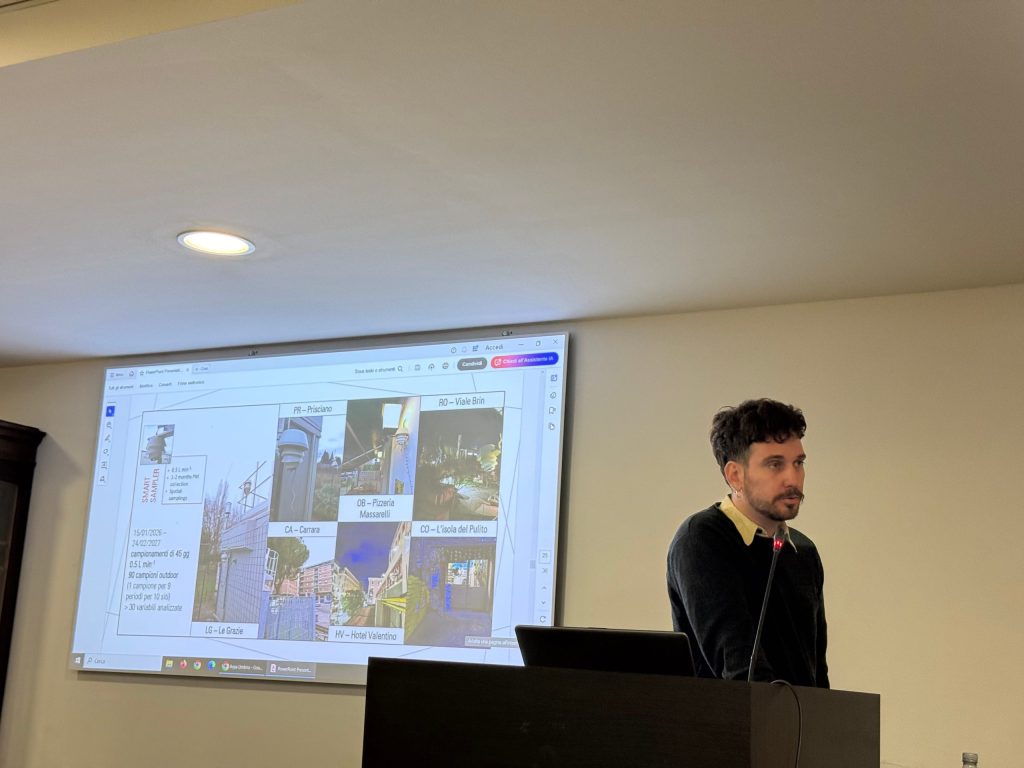 A man presenting at a conference with a projector displaying a collage of images related to various locations, including descriptions.